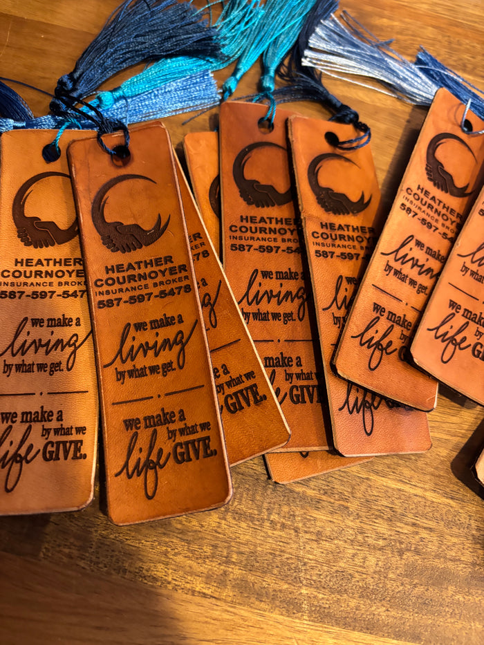 Custom leather bookmarks engraved with a business logo