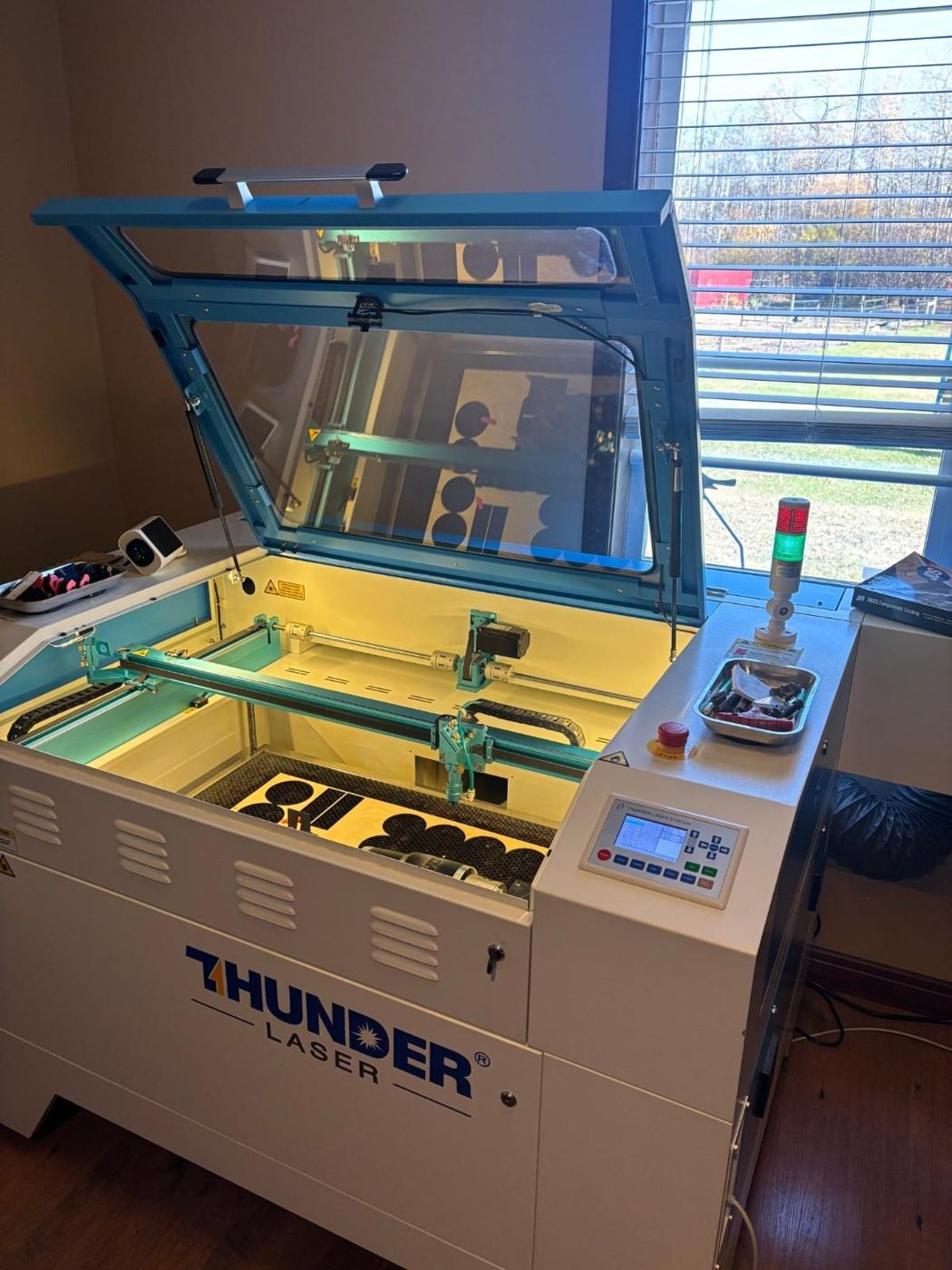 The Thunder CO2 laser in the Wild Touch Engraving shop